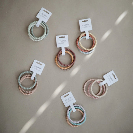 Mushie Bijtring Armband Siliconen Lilac/Cyan/Soft Peach 3st koop je bij Babywinkel